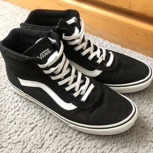 Black and white high top vans